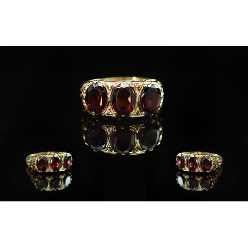 85 - Ladies 9ct Gold Gallery Set 3 Stone Garnet Set Ring. Open-worked Setting. Full Hallmark for 9,375 to... 