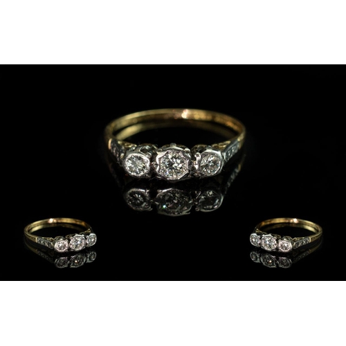 90 - 18ct Gold and Platinum 3 Stone Diamond Set Ring. Marked 18ct and Platinum. The 3 Round Faceted Diamo... 