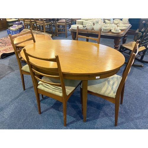 1006 - 1960's Extendible Teak Table & Chairs, table of oval shape, measures 54'' x 38'', height 29''.  Plea... 