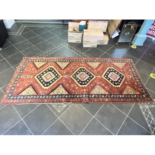 1043 - Terracotta Ground Persian Kashqai Nomadic Rug.  Approx 3 m x 120 cm.