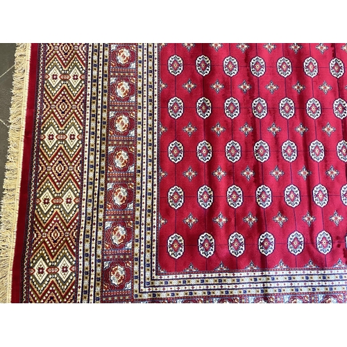 1048 - Rich Red Ground Full Pile Kashmir Carpet, all over Bokhara design.  Measures 2 m x 3 m.