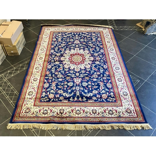 1049 - A Handmade Belgian Wool and Silk Rug. Beige ground. Measures 250 by 150m. In very good condition.