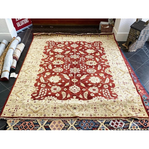 1050 - A Handmade Egyptian Rug. Red and Beige ground. Complete with certificate of authenticity and origin ... 