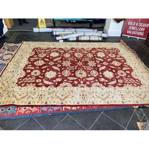 1050 - A Handmade Egyptian Rug. Red and Beige ground. Complete with certificate of authenticity and origin ... 