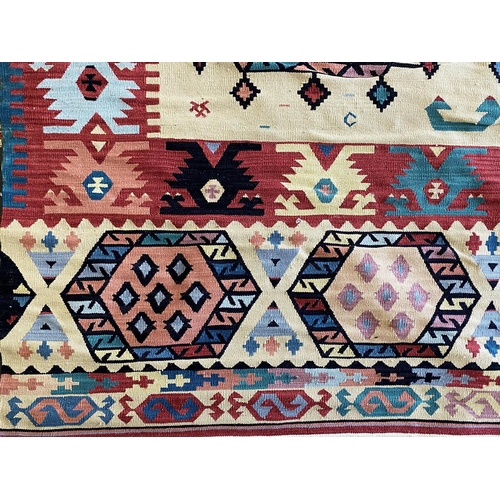 1054 - An Aztec Design Woolen Rug, Beige Ground, Bright Geometric Decoration, 360 x 275cm.