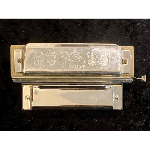 1105 - M Hohner 'The Chromonica' Harmonica, made in Germany, together with a Victory Harmonica.