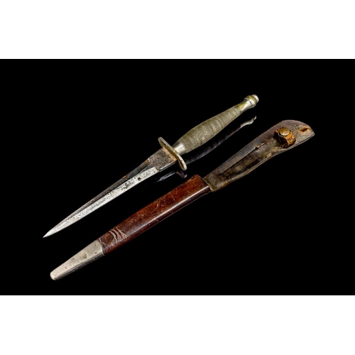 1301 - A Rare Fairbairn Sykes 1st Pattern Fighting Knife, by Wilkinson Sword, with 16cm blade, in metal mou... 