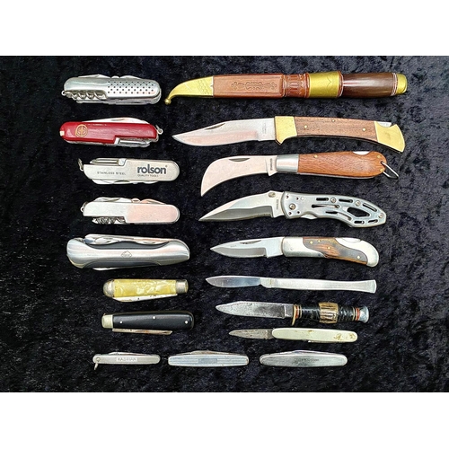 1330 - A Tin Containing a Collection of Pocket Knives and Swiss Army Knives, various designs.