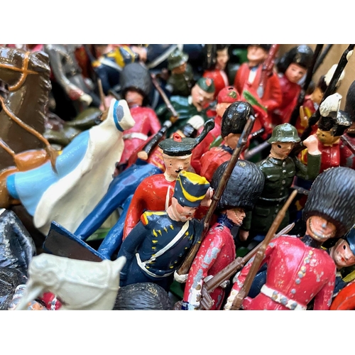 1332 - Collection of Britain's Hand Painted Lead Soldiers, together with some plastic figures, comprising  ... 