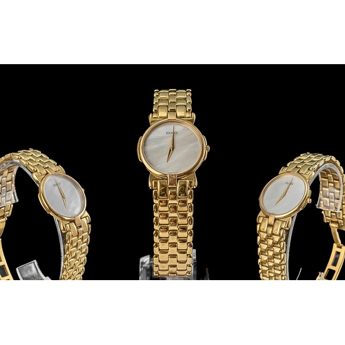 143 - Gucci Ladies Gold Plated Wristwatch with Mother of Pearl Dial gold hands, deployment clasp. Overall ... 