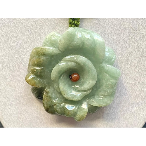 446 - Green Jade Carved Flower Pendant Necklace, the necklace comprising carved multicolour jade beads and... 