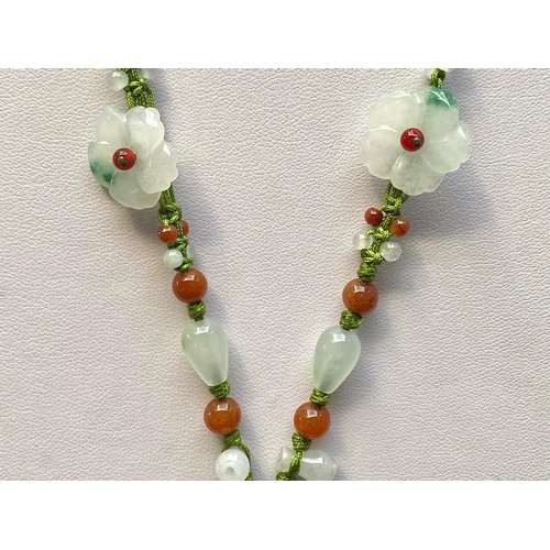 446 - Green Jade Carved Flower Pendant Necklace, the necklace comprising carved multicolour jade beads and... 