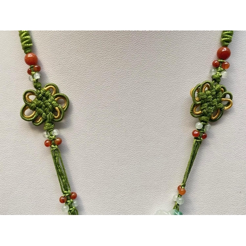 446 - Green Jade Carved Flower Pendant Necklace, the necklace comprising carved multicolour jade beads and... 