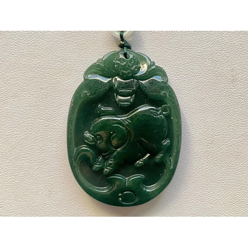 451 - Two Jade Chinese Zodiac Pendant Necklaces, both pendants carved with a pig representing the the Chin... 