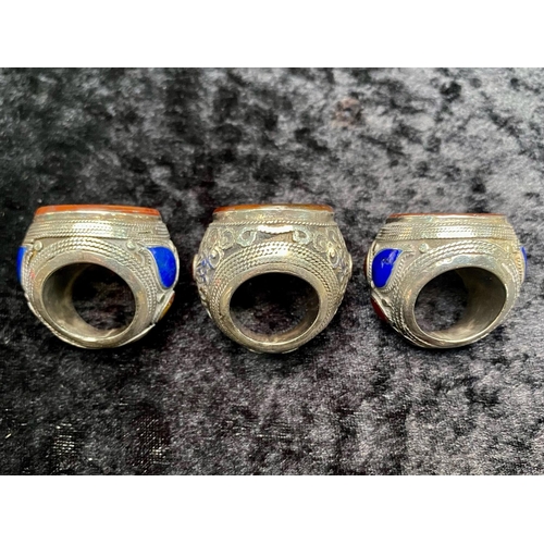 454 - Three Very Large Unusual Stone Set White Metal Rings, all inset with large, round cornelians, the hu... 