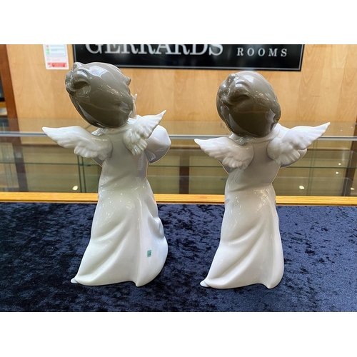 611 - Two Lladro Angels, measuring approx. 9'' tall, 'Curious Angels'.  In excellent condition.  HN 4960.