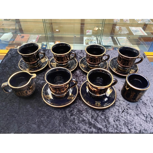 646 - Greek Coffee Set, hand made, black with gilt Grecian figures, comprising six mugs, six saucers, a mi... 