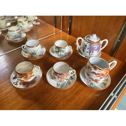 852 - A Part Japanese Teaset comprising milk jug, two handled sugar bowl and 6 cups and 6 saucers.