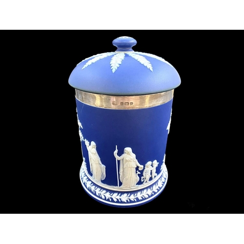 587 - An Edwardian Wedgwood Deep Blue Dip Jar and Cover with silver rim (full hallmarks). Decorated with c... 