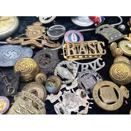 1333 - A Mixed Military Lot, to include cap badges, marching compass named F Barker & Sons dated 1939, whis... 