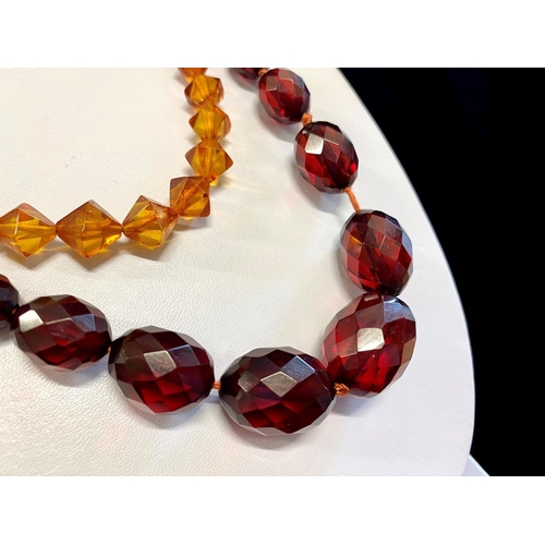 447 - Reconstituted Red Amber Faceted Necklace, c1925, beautiful, graduated beads, fastening with a grub s... 