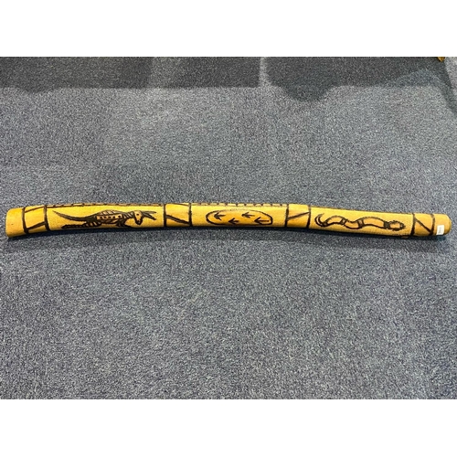 1100 - Australian Carved Wood Didgeridoo, decorated with carvings of kangaroos and snakes.  Measures 56'' t... 