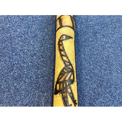 1100 - Australian Carved Wood Didgeridoo, decorated with carvings of kangaroos and snakes.  Measures 56'' t... 