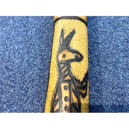 1100 - Australian Carved Wood Didgeridoo, decorated with carvings of kangaroos and snakes.  Measures 56'' t... 