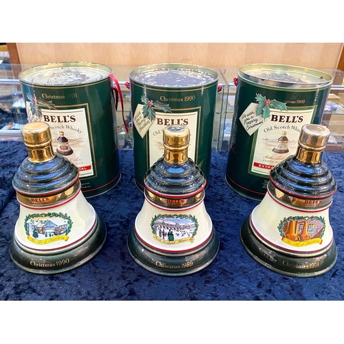 1467 - Three Bells Whisky Christmas Decanters with Contents, dated 1989, 1990 and 1991.  In original tin co... 