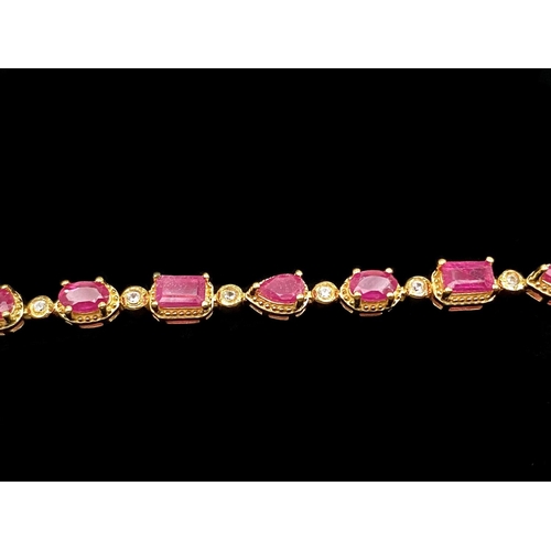 251 - Multi- Cut Ruby Line Bracelet, the row of rubies, unusually, comprising an octagon, an oval, a round... 