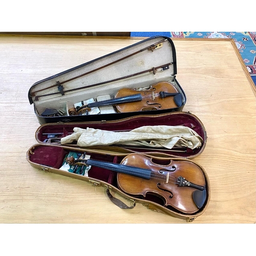 1106 - Two Violins in Cases, one in black case with accessories, the other in a wood effect case lined in r... 