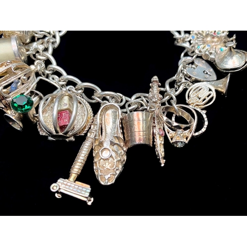 257 - Chunky Silver Charm Bracelet, Loaded with Different Charms, Which Includes Telephone, lamp, shoe, Ho... 