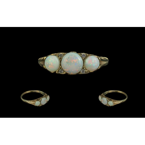 304 - Antique Period Attractive 9ct Gold Three Stone Opal Set Ring, ornate setting, full hallmark to shank... 