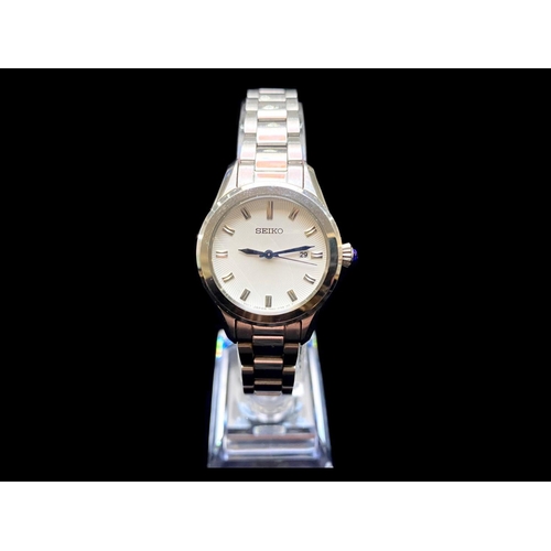 346 - Ladies Seiko Bracelet Watch, silver tone bracelet, white dial with silver batons, date aperture.  In... 