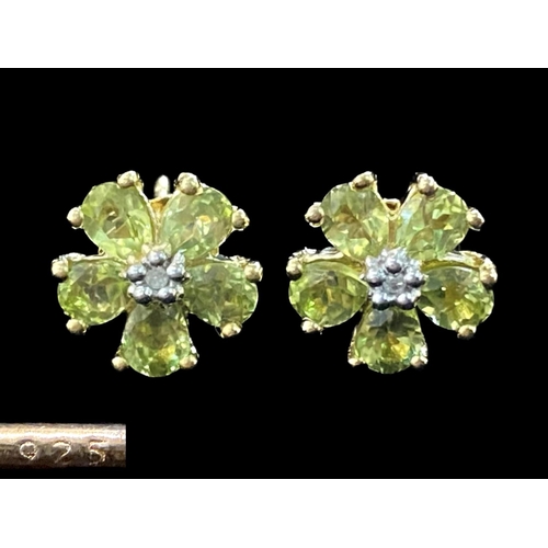 305 - Peridot and Diamond Floral Stud Earrings, the five peridot set 'petals', with a diamond to the centr... 