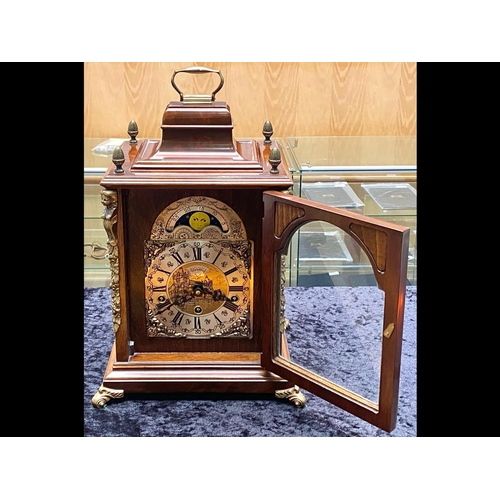 1102 - A Modern Reproduction Bracket Mantle Clock with Ormolu decoration, silvered dial, Moon face and West... 