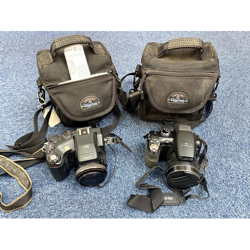 1597 - Two Cameras In Carry Cases, comprising  a Fine Pix S7000 camera, and a Fine Pix Fujifilm S4500.