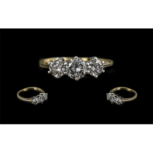 22A - 18ct Gold Attractive Three Stone Diamond Set Ring, marked 750 to interior of shank.  The three brill... 