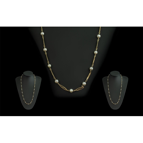 31A - 18ct Gold Attractive Necklace set with cultured pearl spacers, marked 750 - 18ct; weight 15.7g, leng... 