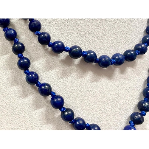 450 - A Lapis Lazuli Bead Necklace with black tassel trim.