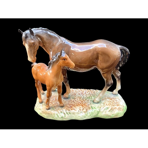 517 - Beswick Palomino Horse Figure, facing right, swish tail and gloss finish, together with a Beswick da... 