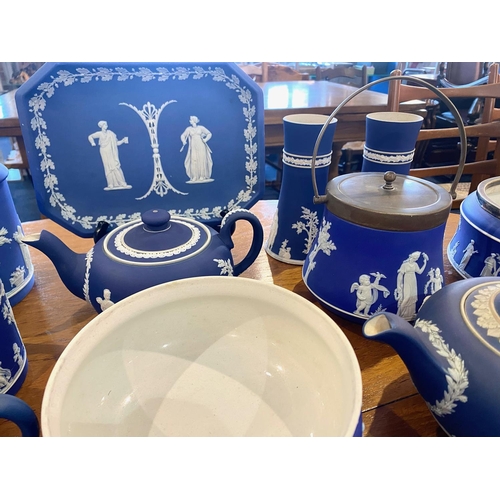 551 - A Large Collection of Wedgwood Jasper Ware decorated in various classical scenes. Includes a tyg, va... 