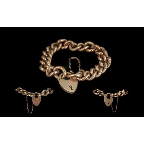 63 - Antique Period Attractive 9ct Gold Curb Bracelet with a 9ct gold heart shaped padlock and safety cha... 