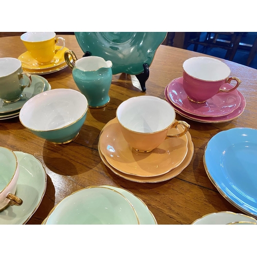 673 - Collection of Royal Stuart Spencer Stevenson Colourful Porcelain, comprising four cups, saucers, and... 