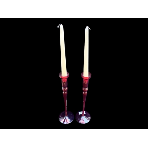 781 - Pair of Tall Red Glass Candlesticks, measure approx  12'' tall.