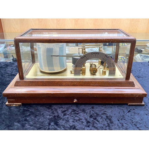 1101 - A Barograph by Negretti and Zambra 'Regent' within glazed case above a chart drawer, approx 42 cms l... 