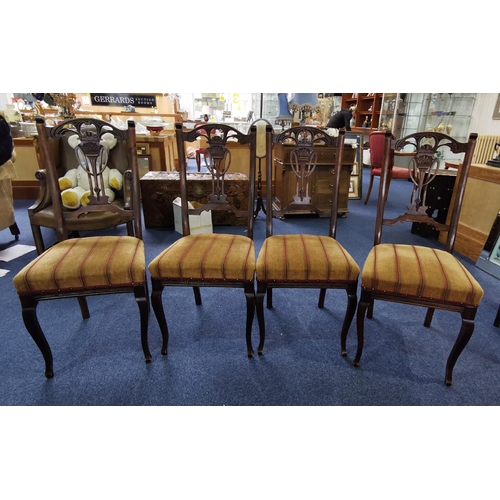 1020 - Four Early 20th Century Dining Chairs, with carved backrests depicting torches, stuffed seats, cabri... 