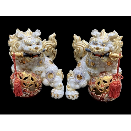 1094 - A Collection of Four Oriental Foo Dogs, two in resin on rectangular plinths, and two porcelain.  Tal... 