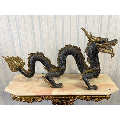 1095 - A Large Chinese Style Four Claw Bronze Dragon, brown textured body with gilt highlights.  Height 60.... 