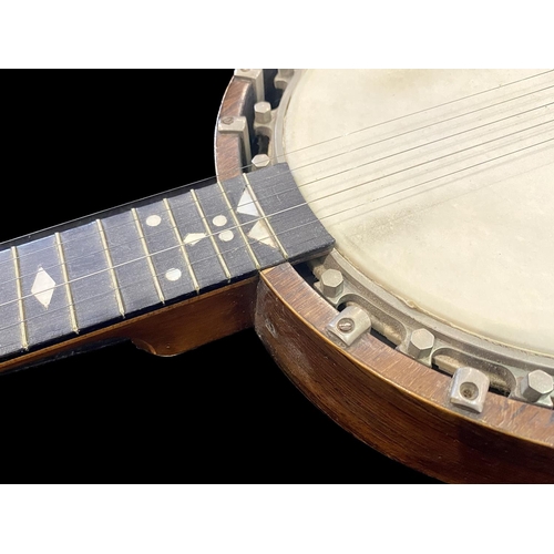 1105 - Windsor Banjo, five string, decorated with mother of pearl to the neck.  In soft case, measures appr... 